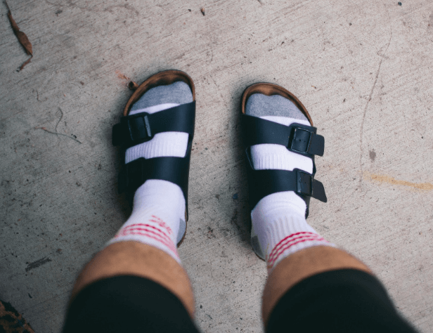 A man wearing high socks and Birkenstocks